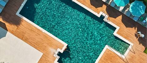 2 outdoor pools, open 8:00 AM to 8:00 PM, pool umbrellas, pool loungers