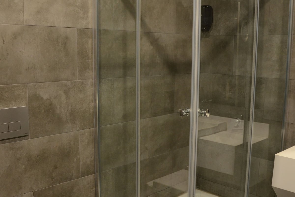 grand room | bathroom | shower, free toiletries, slippers, towels