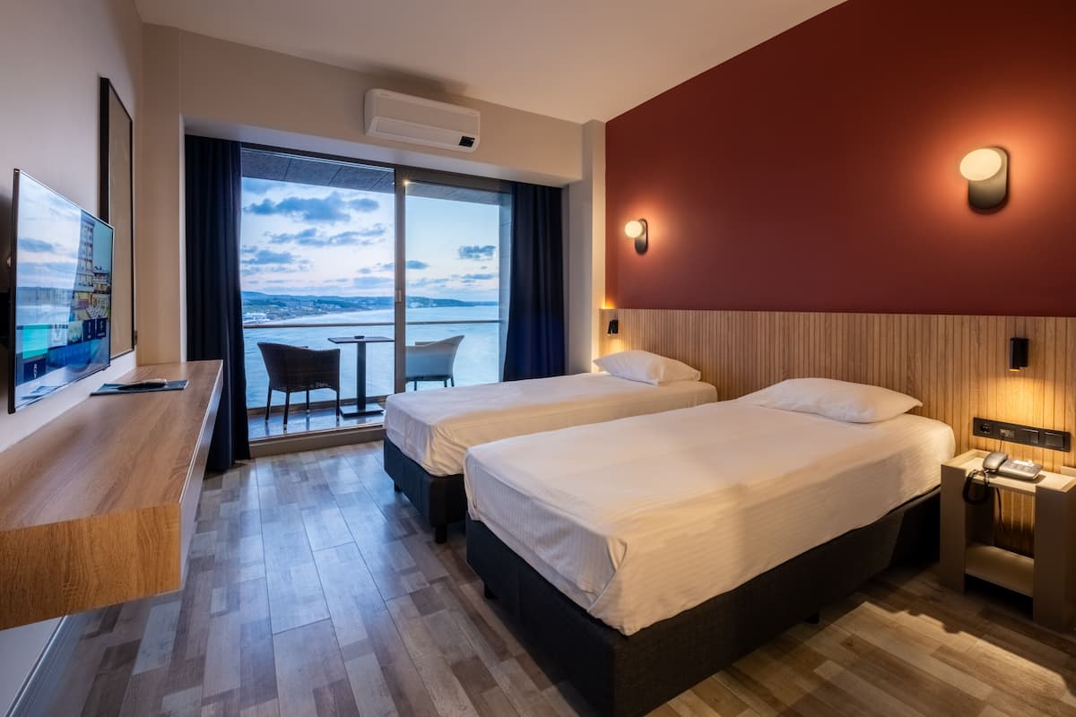 Standard Double or Twin Room, Sea View | Minibar, in-room safe, desk, soundproofing