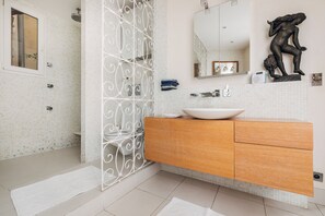 Shower, hair dryer, towels, soap