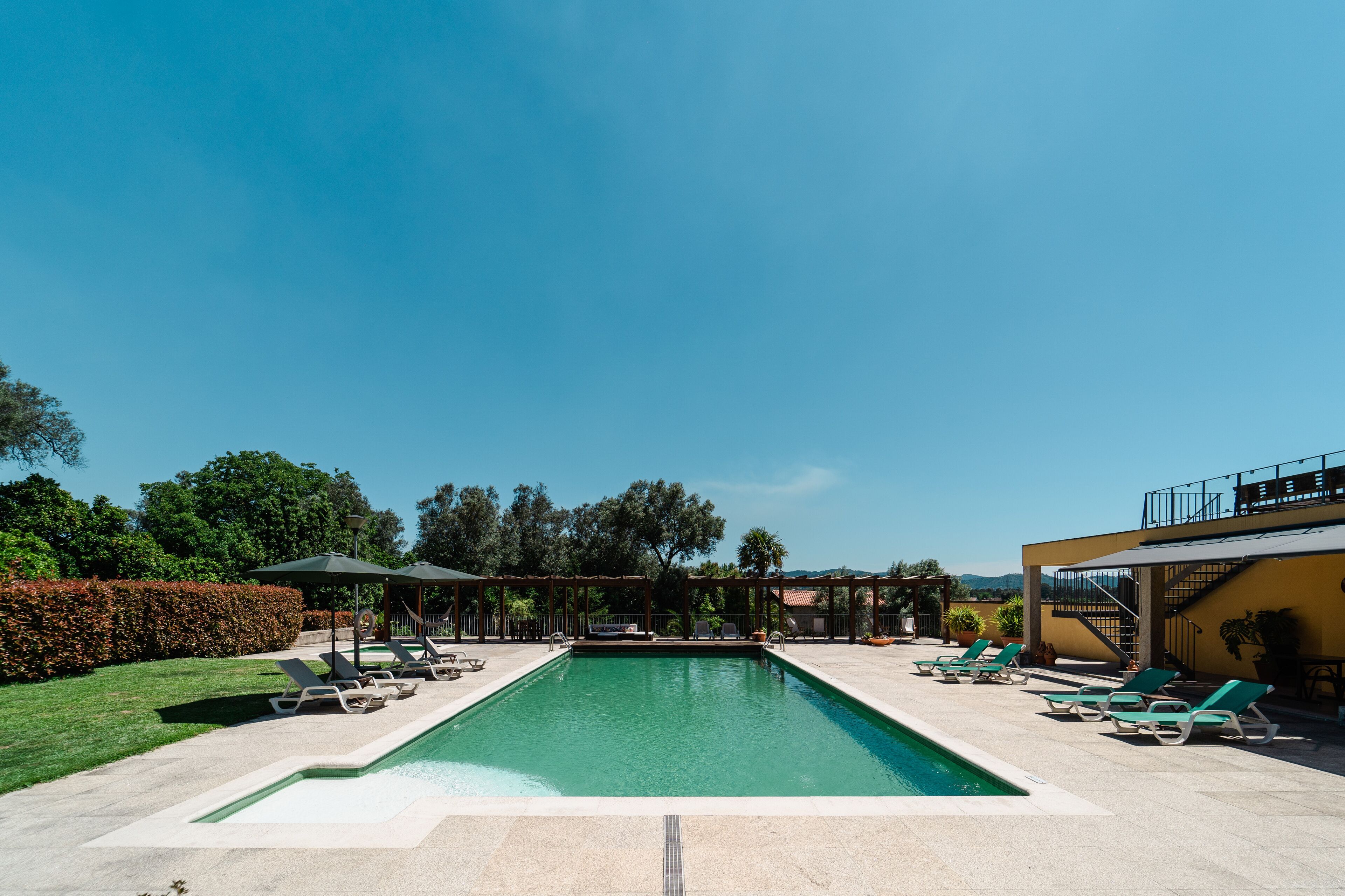 Seasonal outdoor pool, open 8:00 AM to 7:30 PM, pool umbrellas