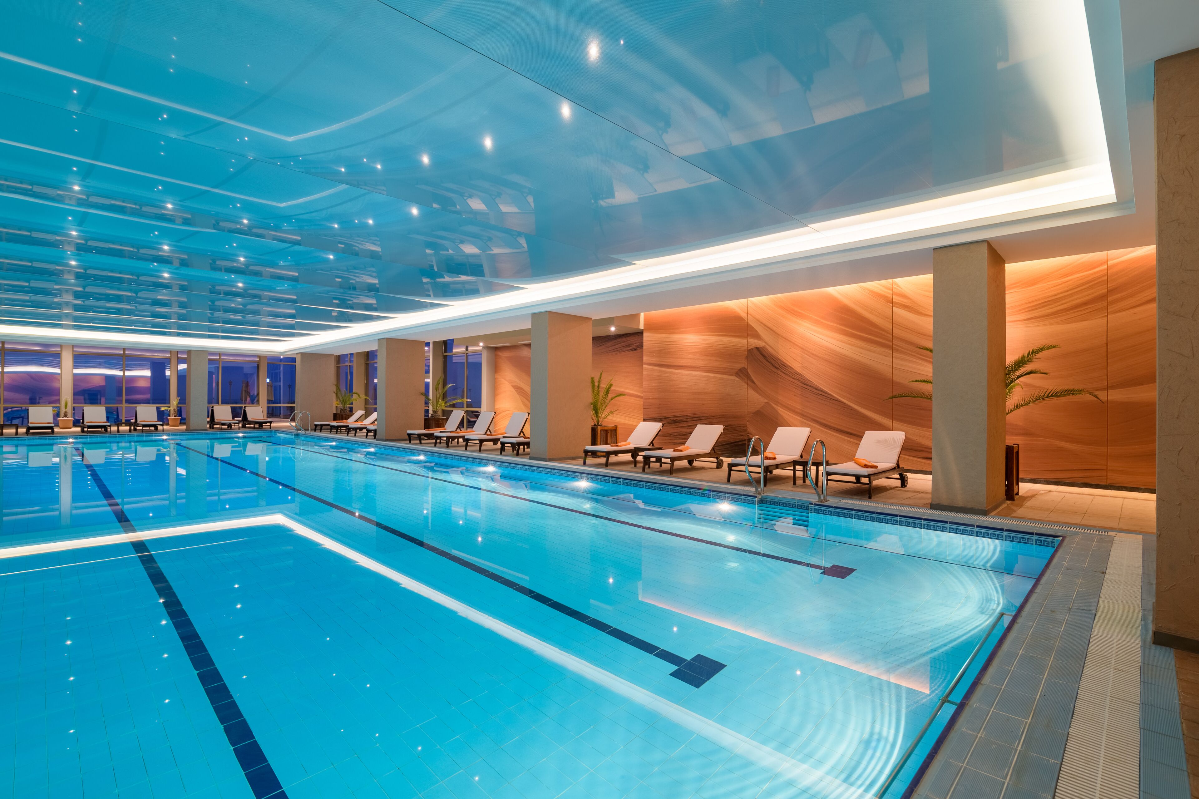 Indoor pool, outdoor pool, pool umbrellas, pool loungers