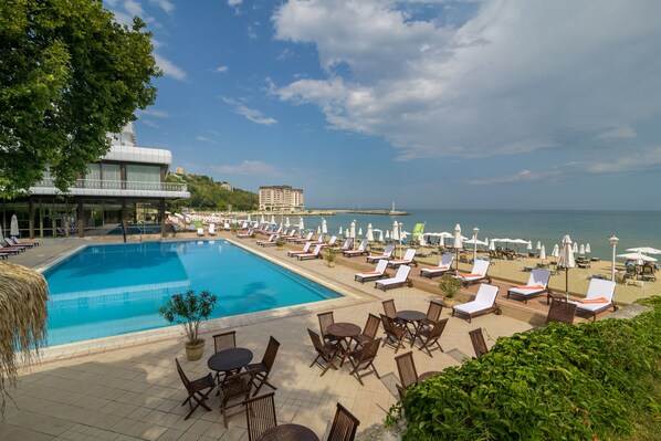 Indoor pool, outdoor pool, pool umbrellas, pool loungers