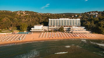 On the beach, sun loungers, beach umbrellas, beach towels