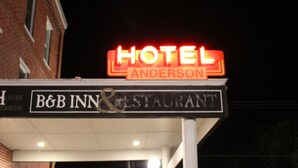 A hotel sign with "HOTEL ANDERSON" and "B&B INN & RESTAURANT" indicating the establishment's name and services. - AH #15 · AH #15 Queen w/Shower (Wabasha)