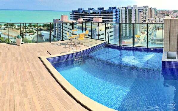 Outdoor pool, pool umbrellas, sun loungers