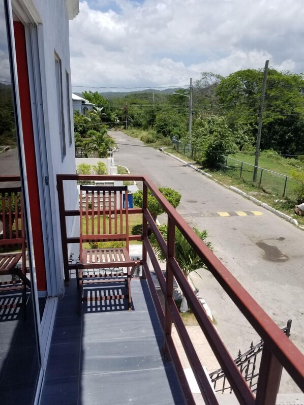 Comfort House, 2 Bedrooms, Hill View | Balcony view - Al's Vacation Home (Spanish Town)