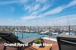 Relax on the waterfront deck with a lounge chair and enjoy the marina views.