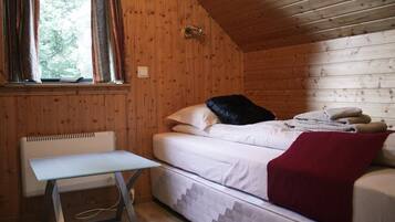 Triple Room, Private Bathroom | Blackout drapes, free cribs/infant beds, free WiFi, bed sheets