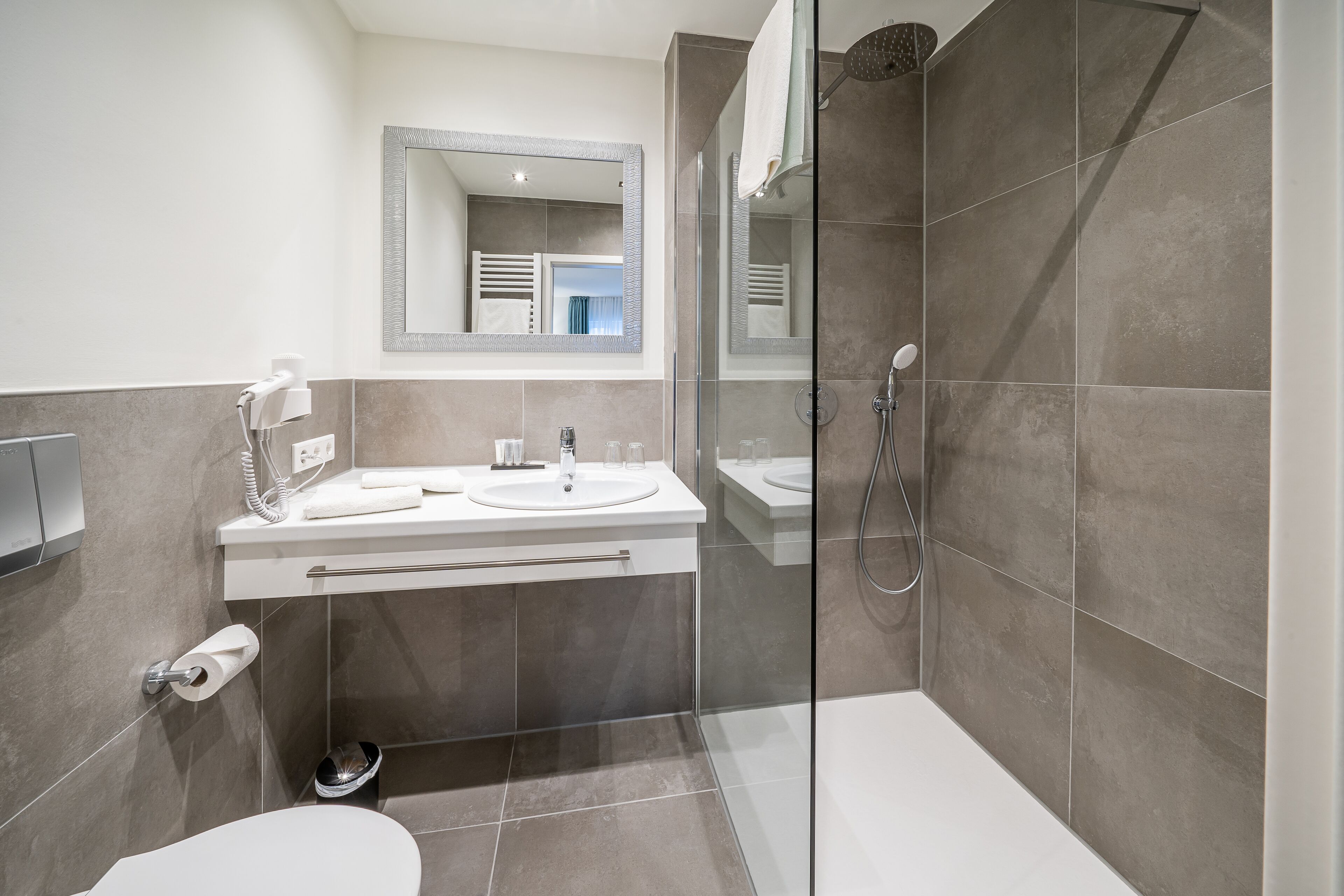 hair dryer, towels, soap, shampoo