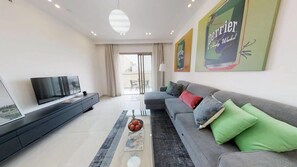 Flat-screen TV, books, offices