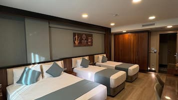 Standard Quadruple Room | Premium bedding, minibar, in-room safe, blackout curtains