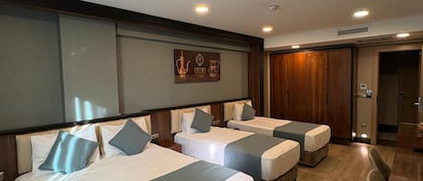 Standard Quadruple Room | Premium bedding, minibar, in-room safe, blackout drapes