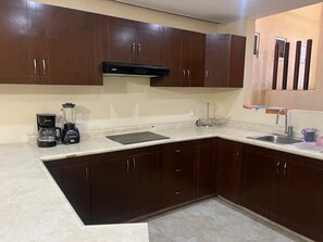 Full-size fridge, stovetop, toaster, blender