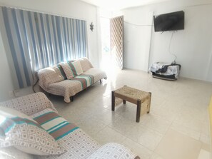 Superior Apartment, 3 Bedrooms, Ground Floor | Living area | 55-inch TV with digital channels