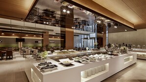 A modern hotel dining area with a buffet setup, multiple seating areas, and a high ceiling with reflective surfaces. - Ramada Encore by Wyndham Gimpo Han River Hotel (Gimpo)