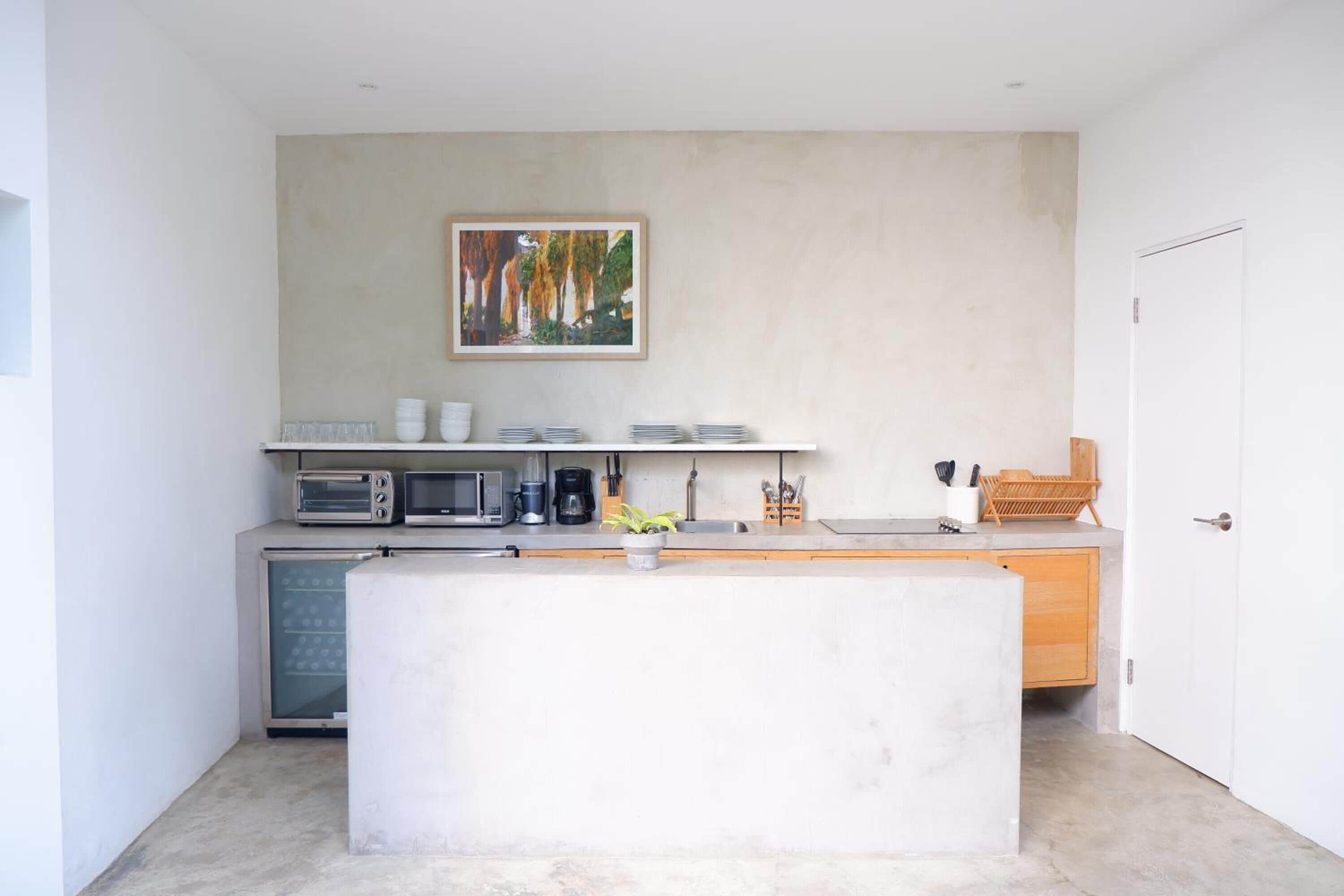 full-sized fridge, microwave, stovetop, coffee/tea maker