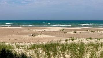 On the beach, sun loungers, beach towels