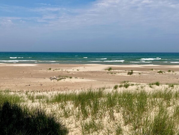 On the beach, sun-loungers, beach towels