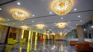 A spacious lobby with marble flooring, multiple seating areas, and ornate chandeliers. - CITADEL Hotel By Vinnca (Hyderabad)