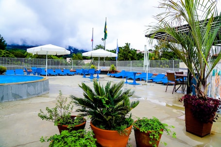 Outdoor pool, open 8:00 AM to 7:00 PM, pool umbrellas, sun loungers