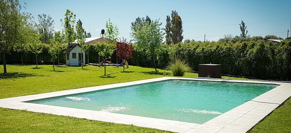 Seasonal outdoor pool, pool umbrellas, pool loungers