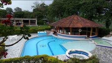 Outdoor pool, open 7:00 AM to 10:30 PM, sun loungers