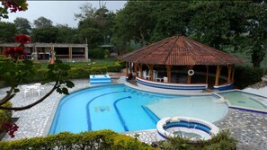 Outdoor pool, open 7:00 AM to 10:30 PM, pool loungers