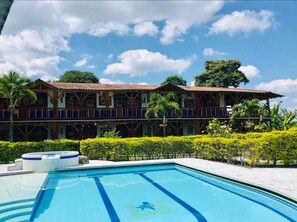 Outdoor pool, open 7:00 AM to 10:30 PM, sun loungers