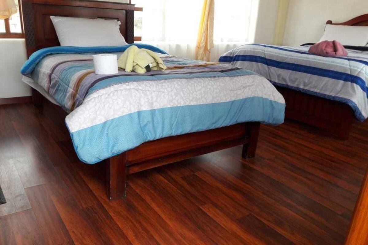 Quarto triplo, várias camas | Cortinas blackout, Wi-Fi de cortesia
