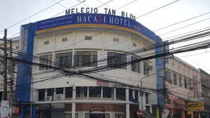 A hotel with a curved facade, multiple floors, and a prominent sign for 'HACASI HOTEL'. - Hacasi Hotel (Tacloban)
