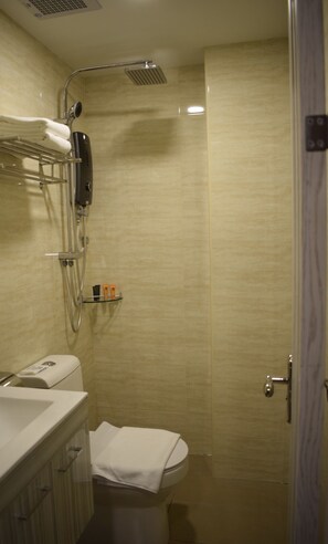 A bathroom with a shower, toilet, and sink. - MM Hotel at Sunway (Petaling Jaya)