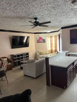 House, 2 Bedrooms, Garden View | Living area | Flat-screen TV - Island Turquoise Rental (Providenciales)