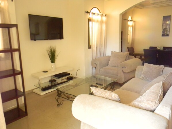 Exclusive Villa | Living room | 49-inch Smart TV with cable channels, TV, Netflix