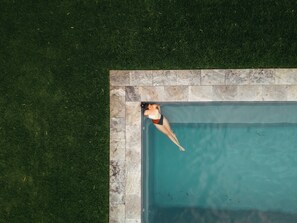 Outdoor pool, open 7:00 AM to 8:00 PM, pool loungers