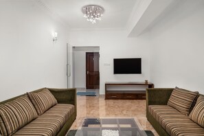 Deluxe tweepersoonskamer, 1 queensize bed | Woonruimte