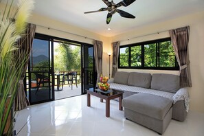 Deluxe Apartment, Kitchen, Mountain View | Living area | Flat-screen TV - Baan Chom View Kamala (Kamala)