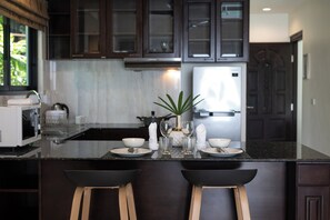 Deluxe Apartment, 2 Bedrooms, Terrace, Partial Sea View | Private kitchen | Full-size fridge, microwave, stovetop, toaster - Baan Chom View Kamala (Kamala)