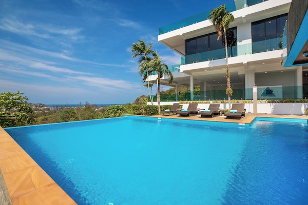 2 outdoor pools, pool umbrellas, sun loungers