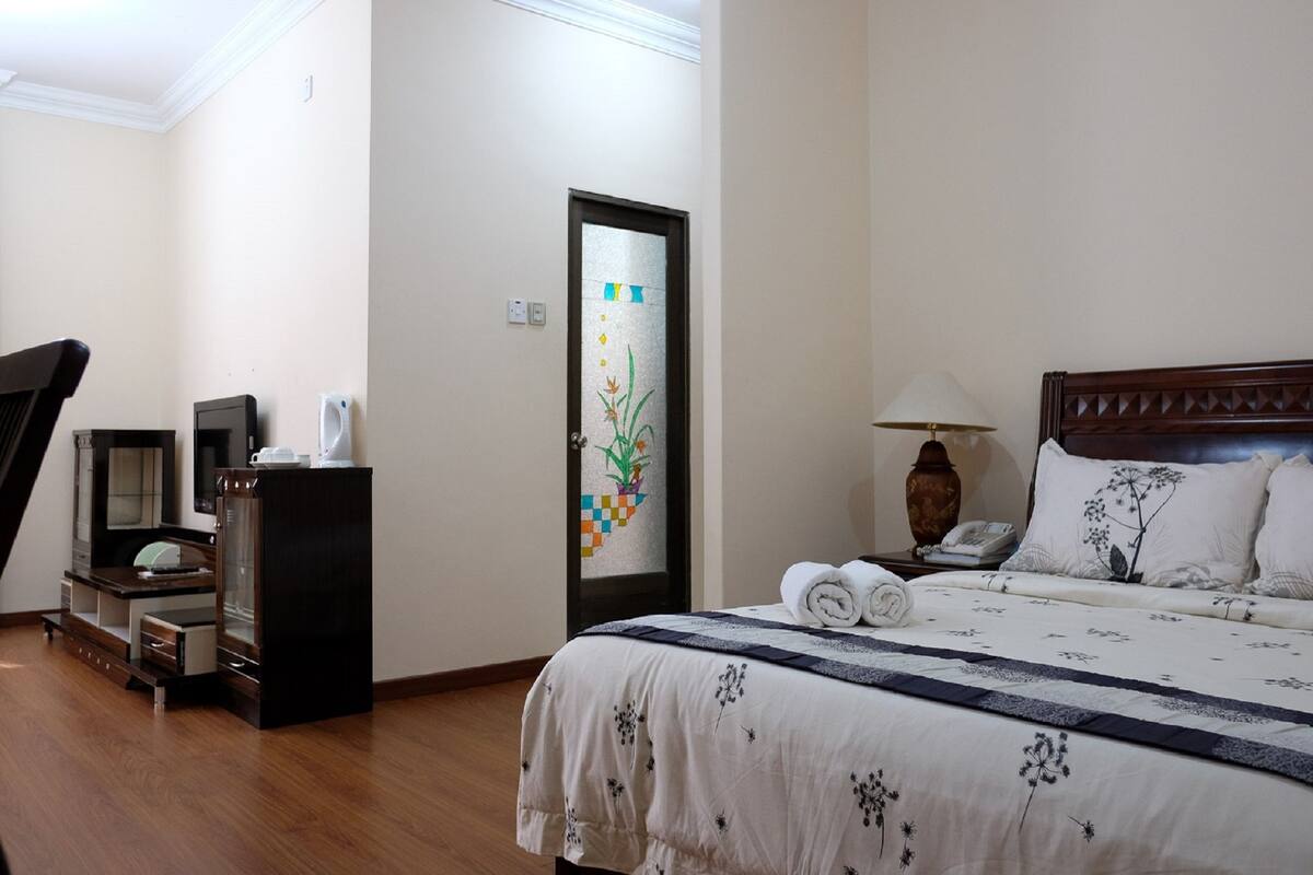 Suite ejecutiva (Super) | Escritorio, cortinas blackout y tabla de planchar con plancha 