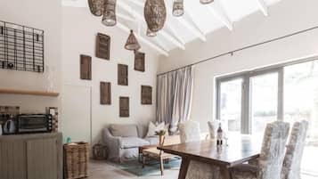 Luxury Suite, 1 Bedroom, Garden View, Courtyard Area (Basil) | Living area | 55-cm Smart TV with premium TV channels, TV, Netflix
