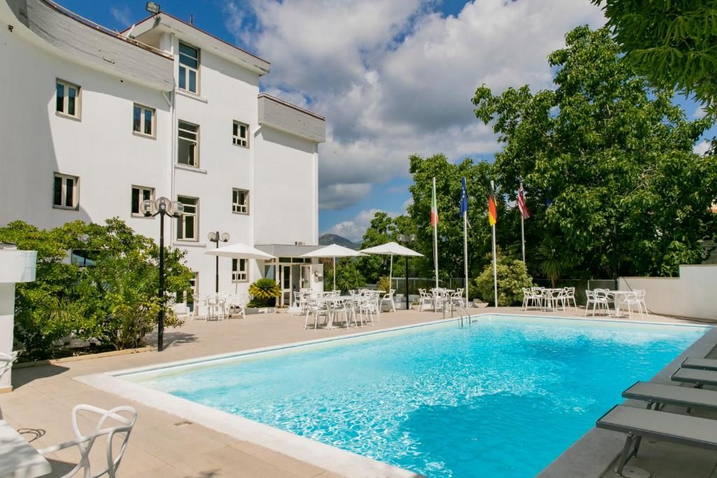 Seasonal outdoor pool, open 9:00 AM to 6:30 PM, pool umbrellas