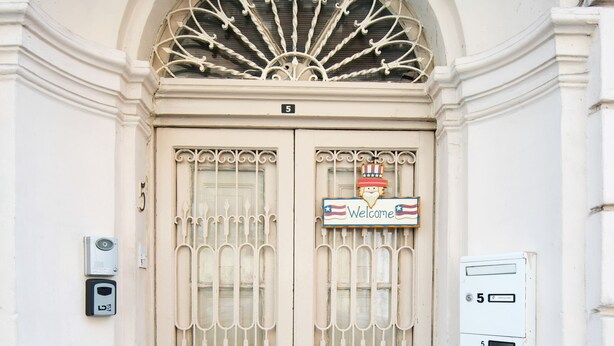 A double door with a decorative metal grille and a welcome sign. - Five Trees B&B (Sliema)