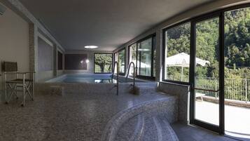 Indoor pool, open 9:00 AM to 7:00 PM, pool loungers