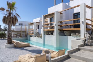 Outdoor pool, open 10:00 AM to 8:00 PM, pool umbrellas, pool loungers