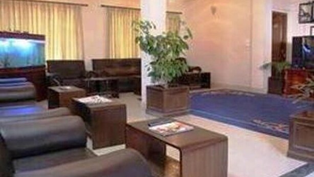 A hotel lobby with a seating area, a television, and a large plant. - Hotel Aradhya Palace (Kathmandu)