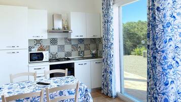 Standard Apartment, 1 Queen Bed | Living area | TV