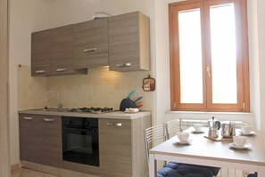 Enjoy cooking and dining in this well-equipped kitchen with stove, oven, and dishwasher.