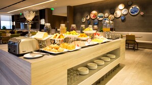 A buffet with various food items and a toaster. - The Mulian Hotel Suzhou Branch (Suzhou)