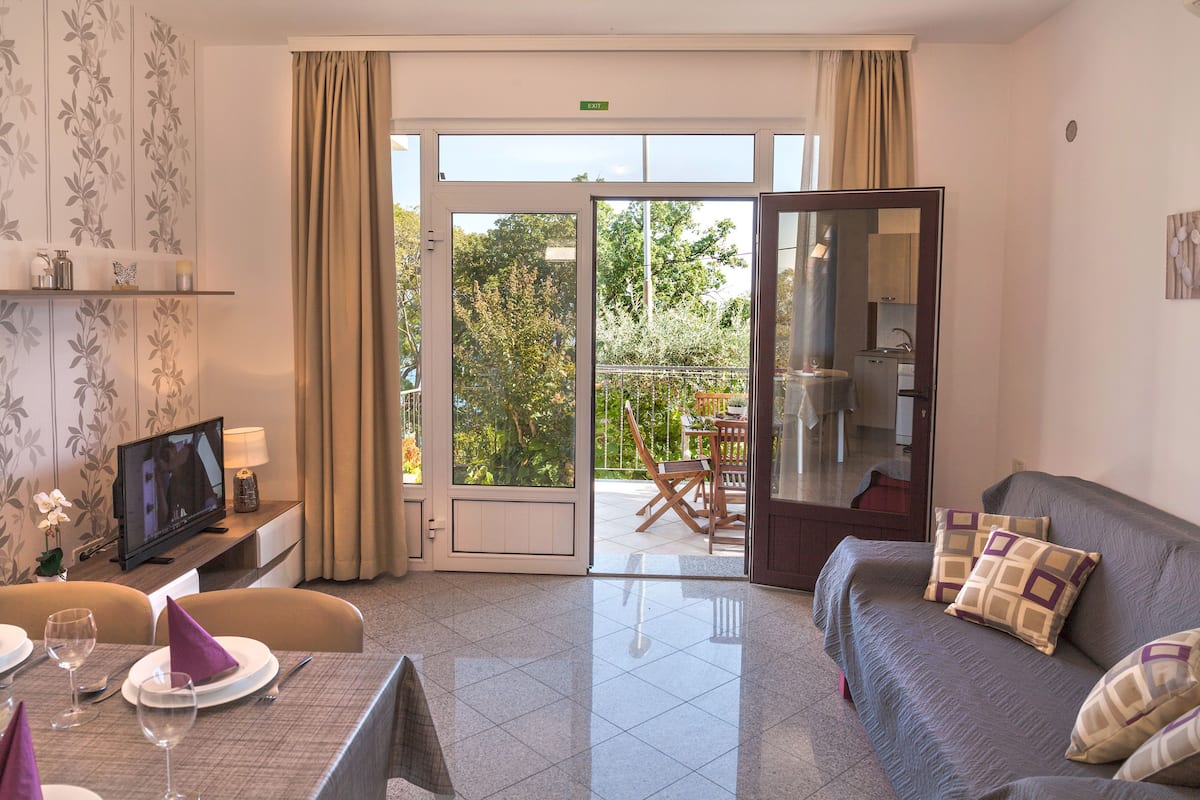 Apartment, Terrace, Sea View | Living area | TV